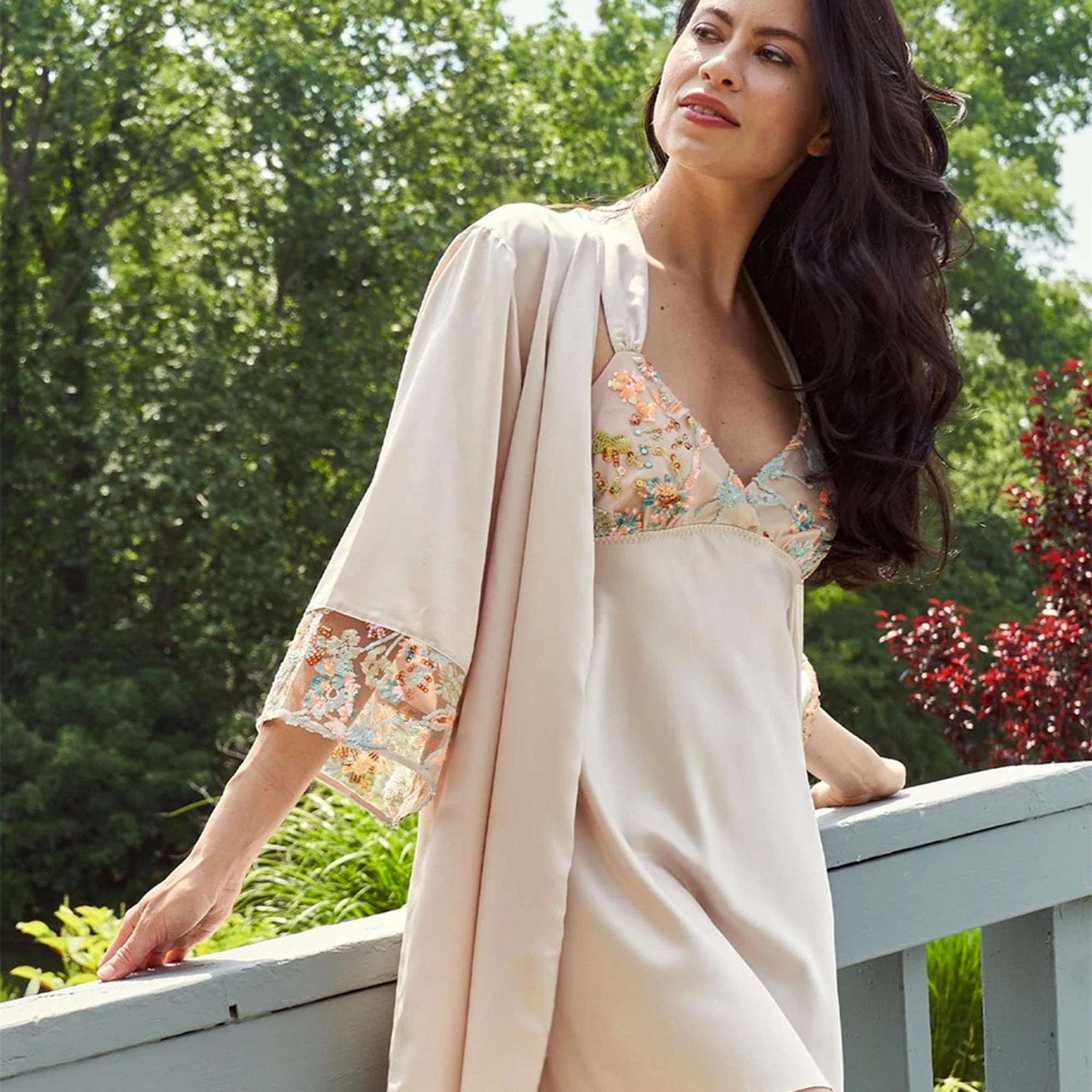 Woman wearing a beige Rya robe and chemise. Collection photo for Belle Lacet Lingerie's Nightgown category