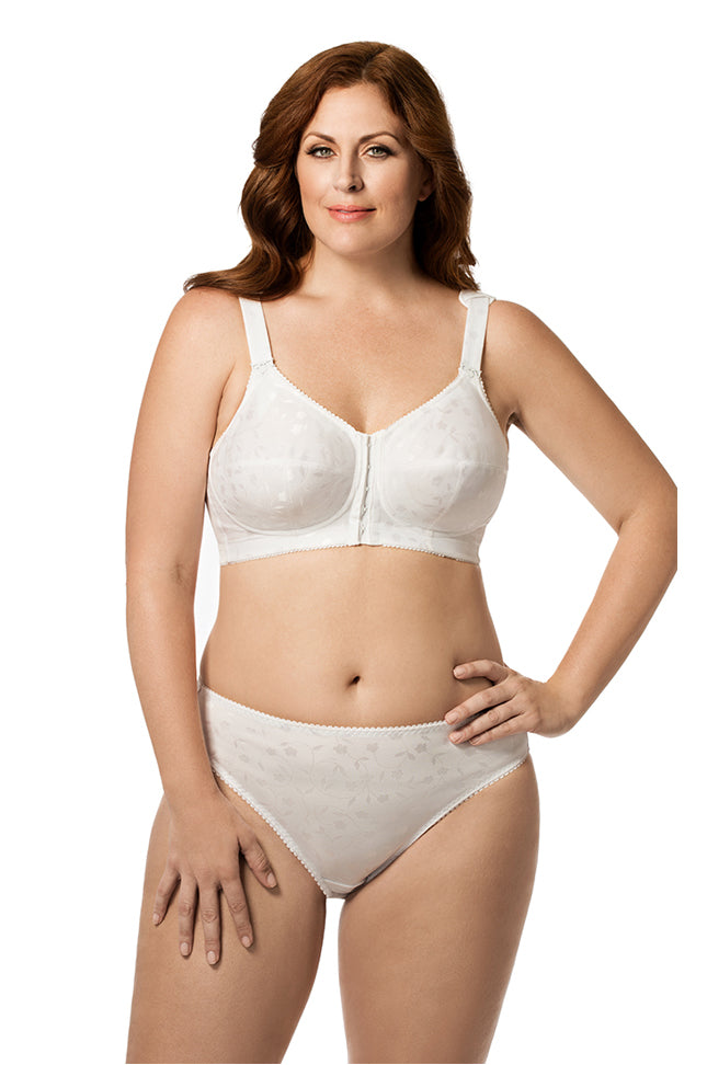Woman wearing a white bra and panties set on a white background