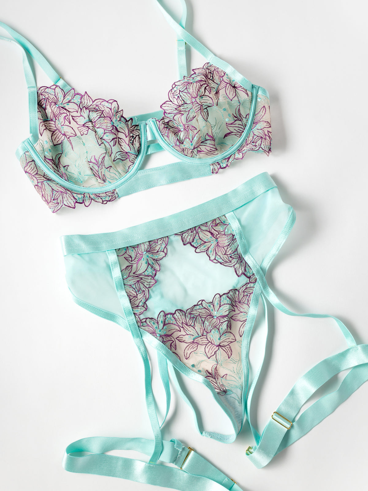 Floral-patterned bikini set with satin straps on a white background