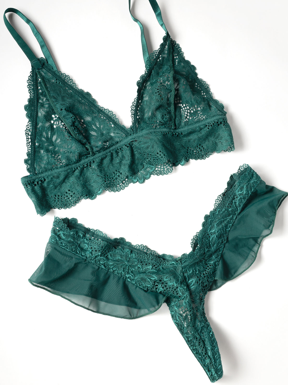 flat lay of a Green lace lingerie set on a white background