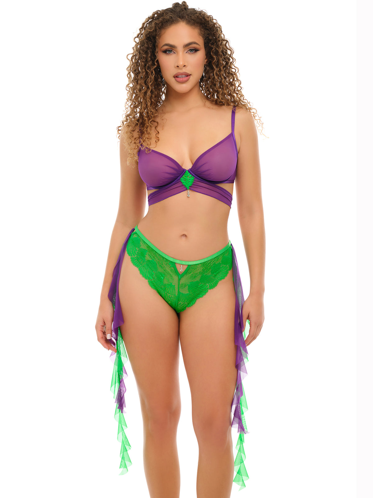 Woman wearing a purple and green bikini with tassels on a white background