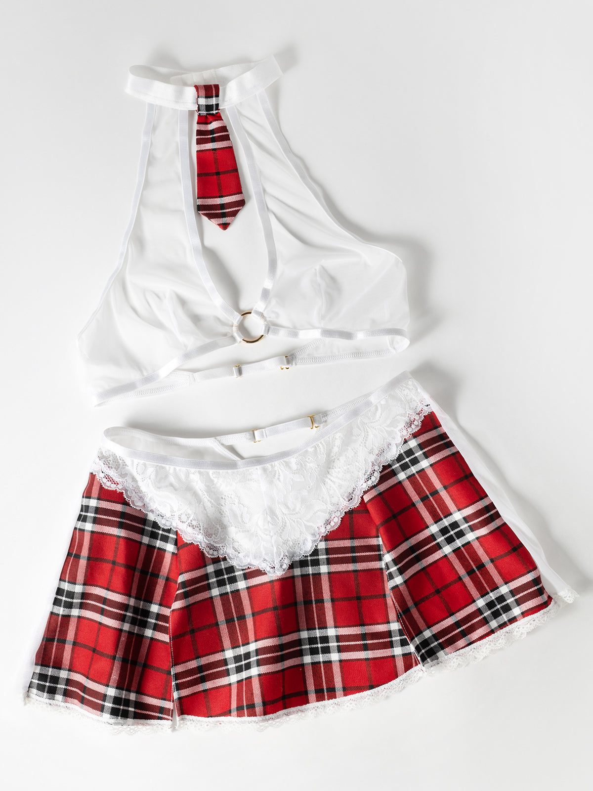 White top with red plaid skirt on a white background
