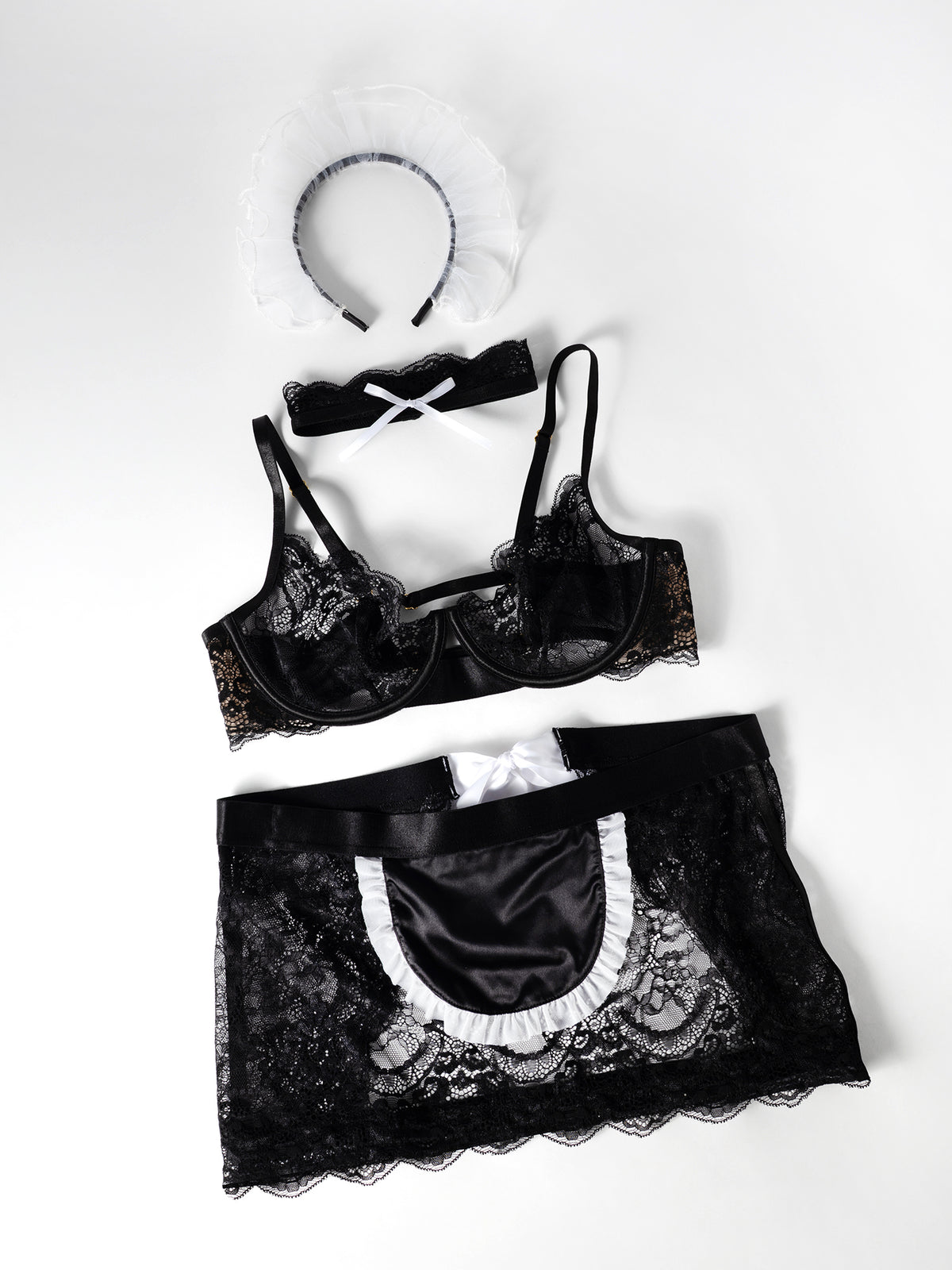 Flat Lay of a Black lace lingerie set on a white background