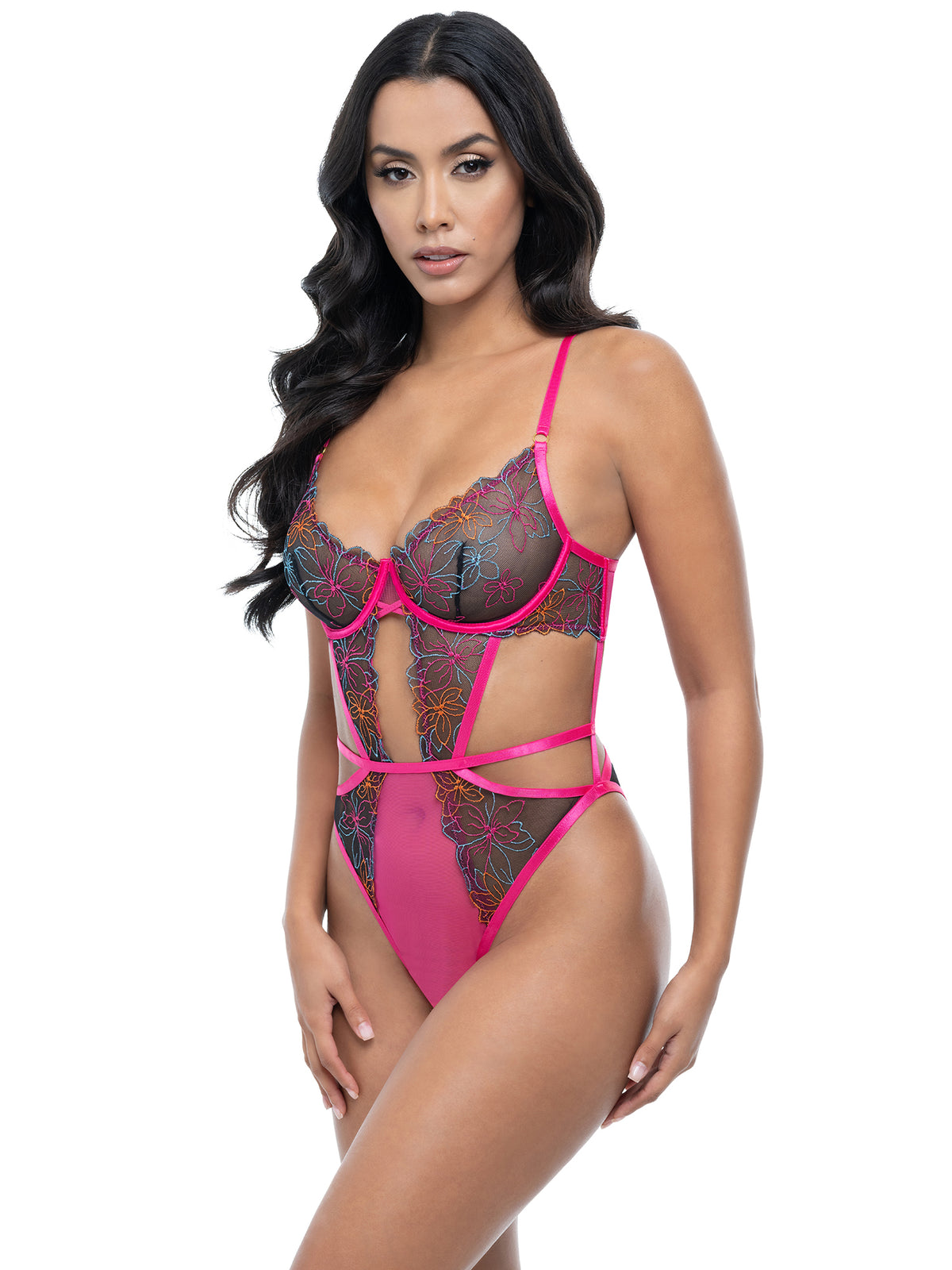 Model wearing a pink lace lingerie set on a white background