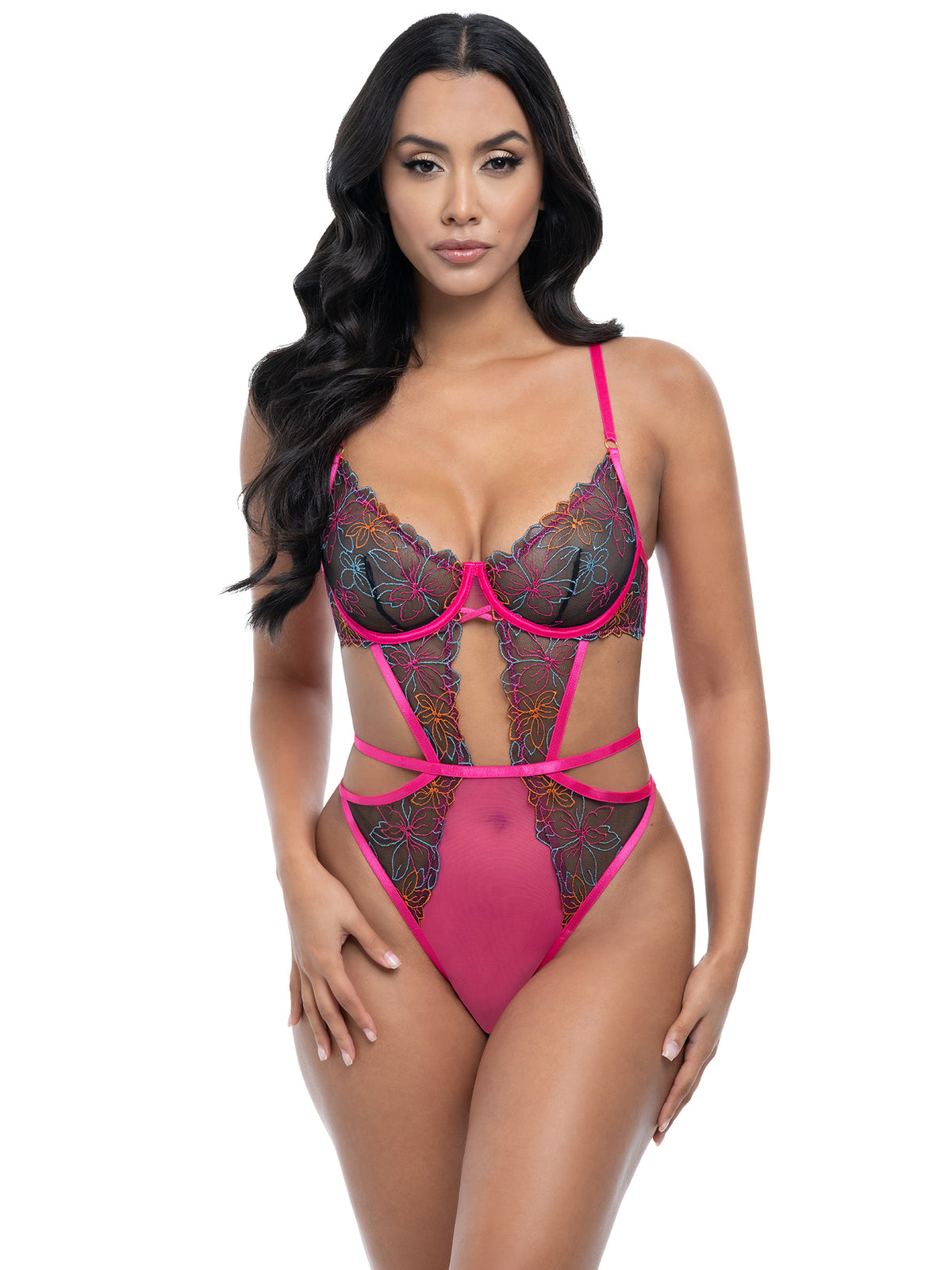 Model wearing a pink lace lingerie set on a white background