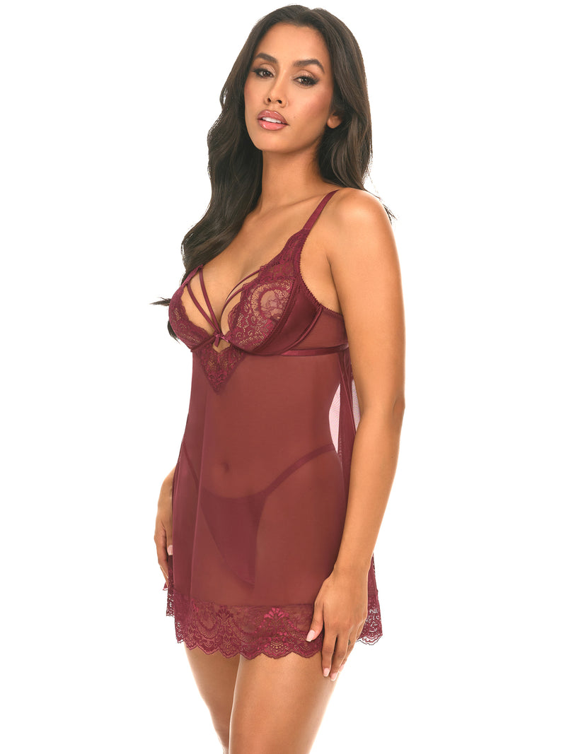 Woman wearing a Wynter Cage lace and mesh babydoll with underwire top and matching G-string