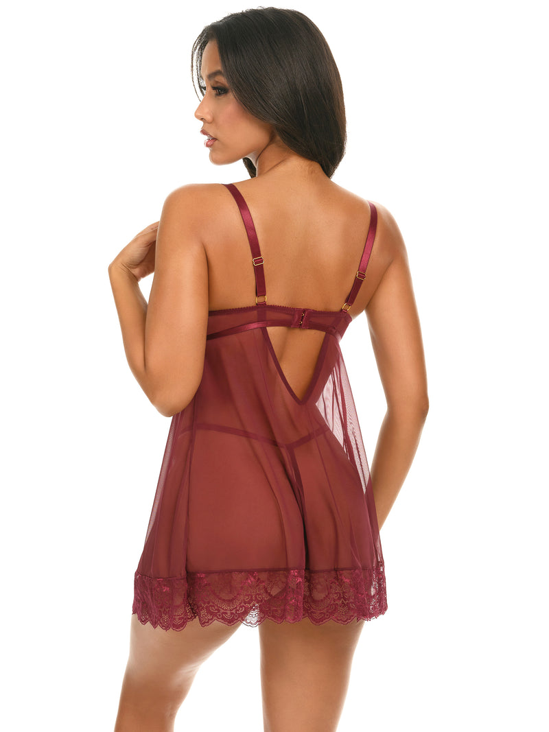 Back view of a Woman wearing a Wynter Cage lace and mesh babydoll with underwire top and matching G-string