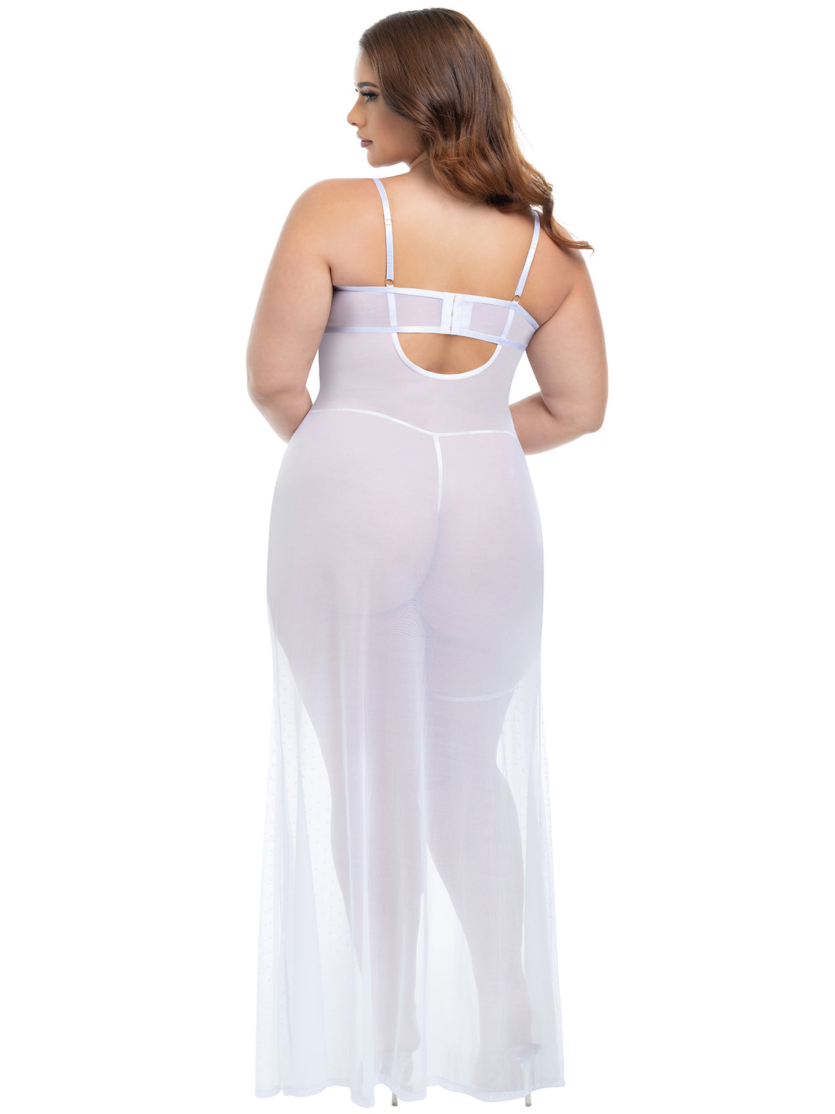 Back view of a woman wearing a plus-size sheer dot mesh bridal gown with lace inserts and matching lace garter