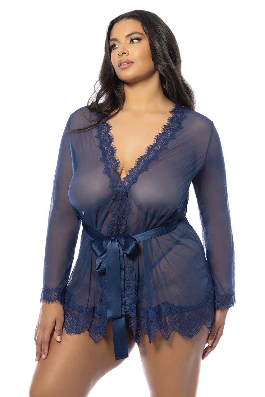 Woman wearing a blue plus-size sheer mesh robe with lace trim, satin waist sash, and matching G-string