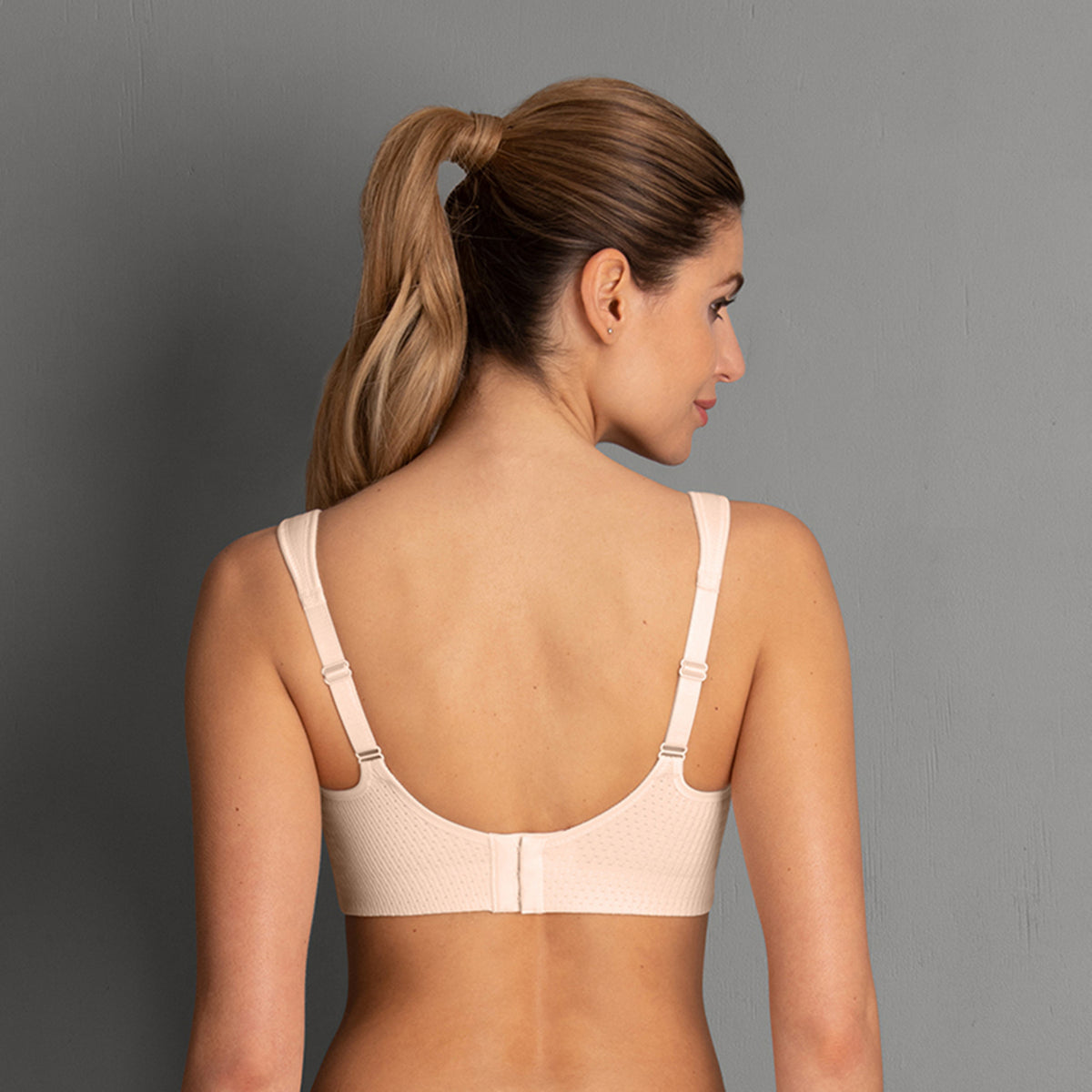 back view of Lightweight, breathable rose colored sports bra with patented DeltaPad cups and strong support for high-impact activity.