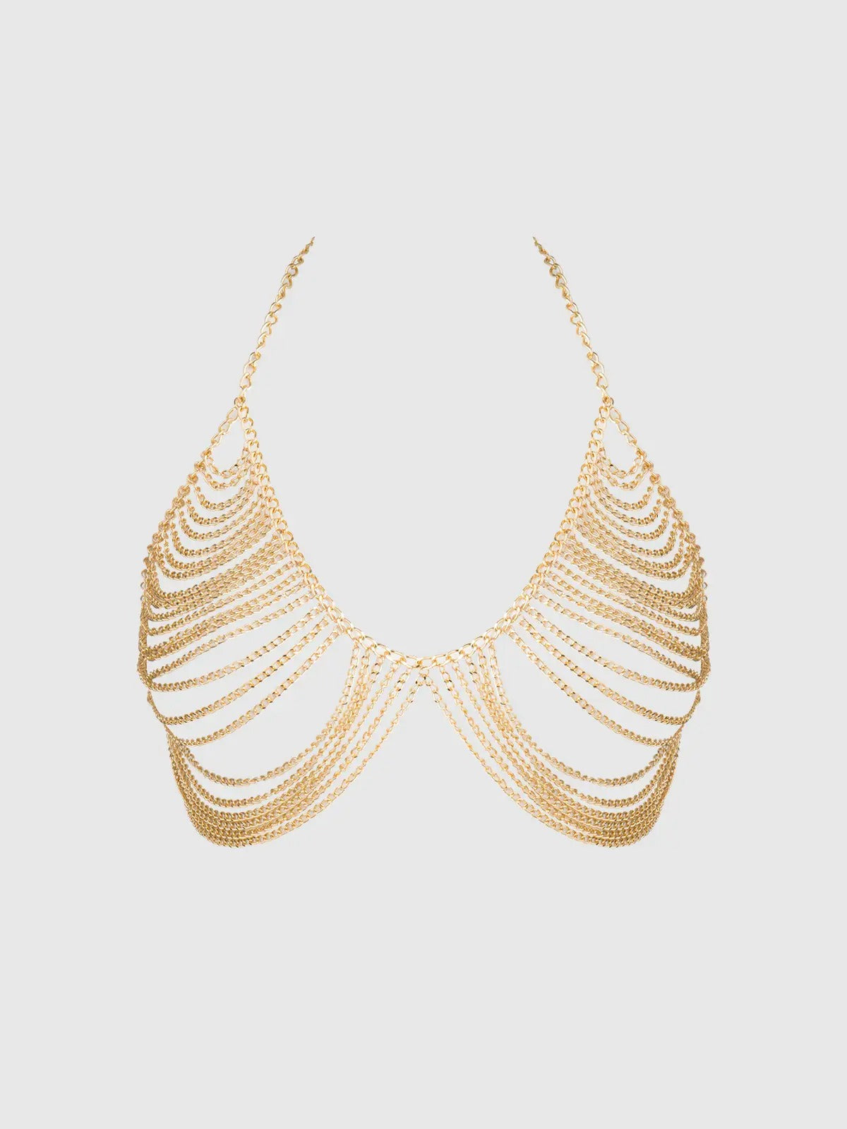 Gold chain necklace on a light gray background