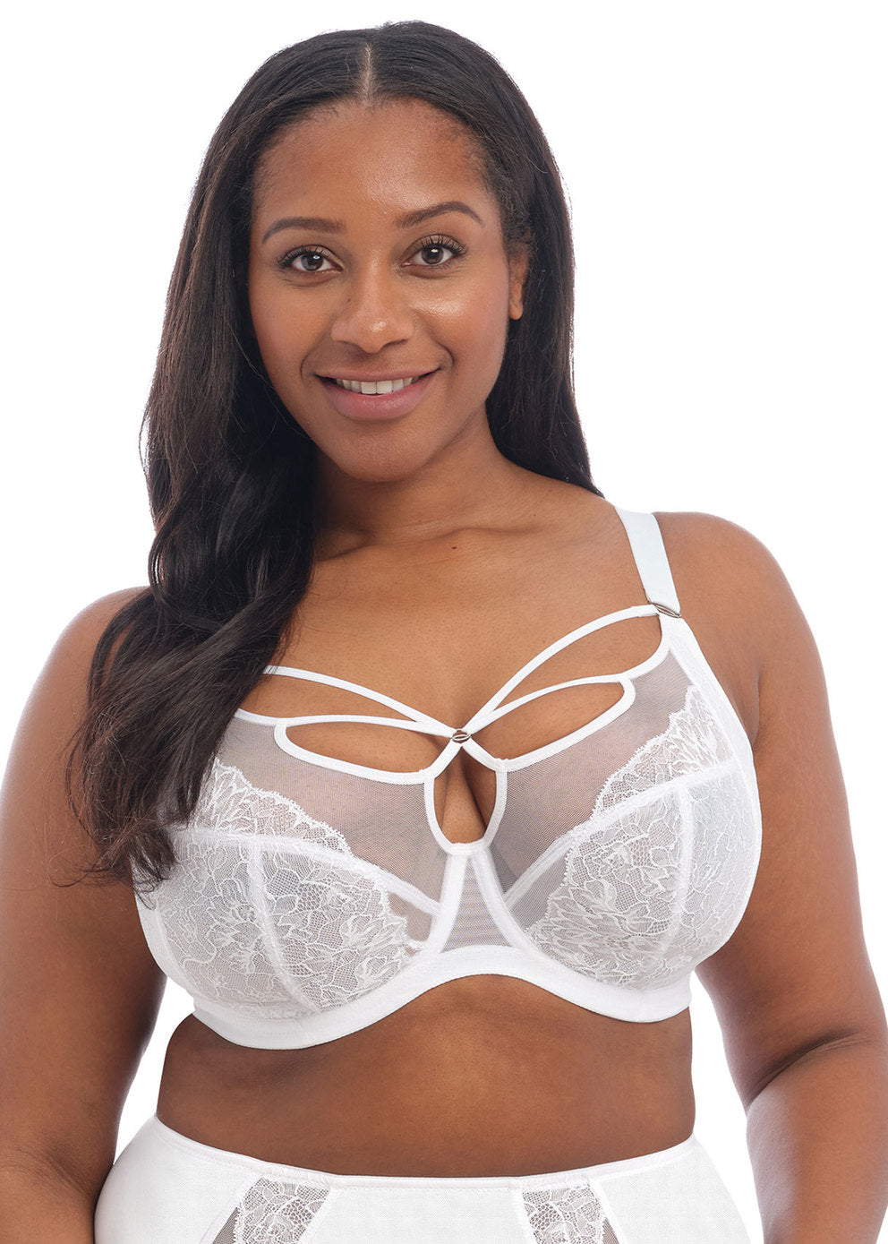 Woman wearing a white Elomi Brianna plunge bra with floral lace overlay and strappy neckline detail.