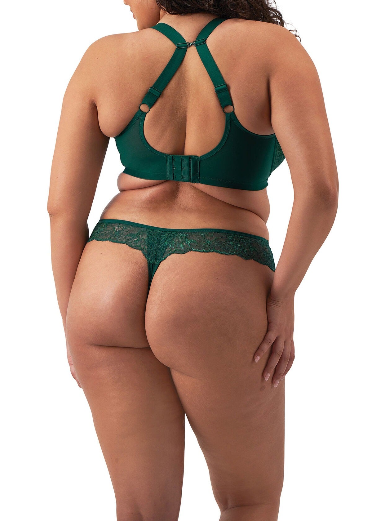 Back view of a Woman wearing a green lace lingerie set on a white background