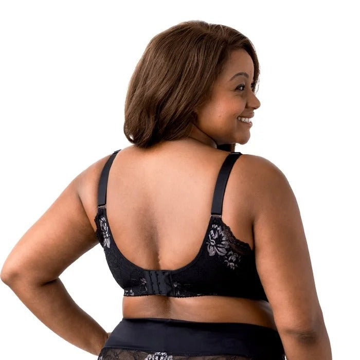 Woman wearing black lace lingerie on a white background