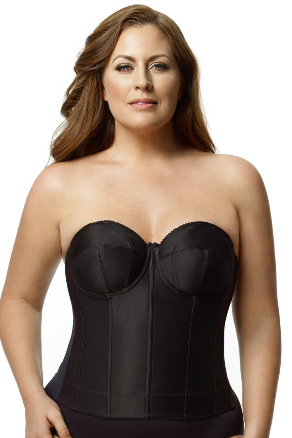 Woman wearing a black strapless corset against a white background