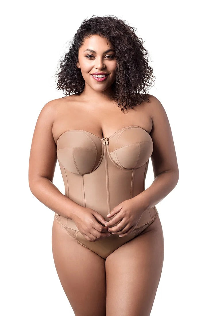 Woman wearing a beige shapewear bodysuit on a white background
