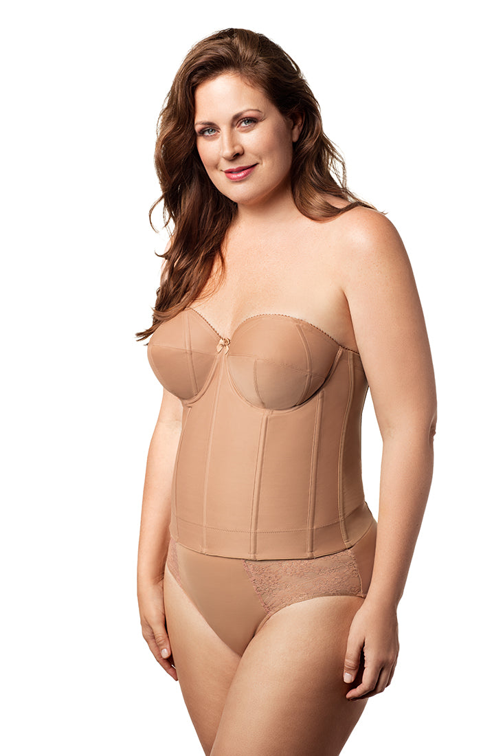 Woman wearing a beige shapewear bodysuit on a white background