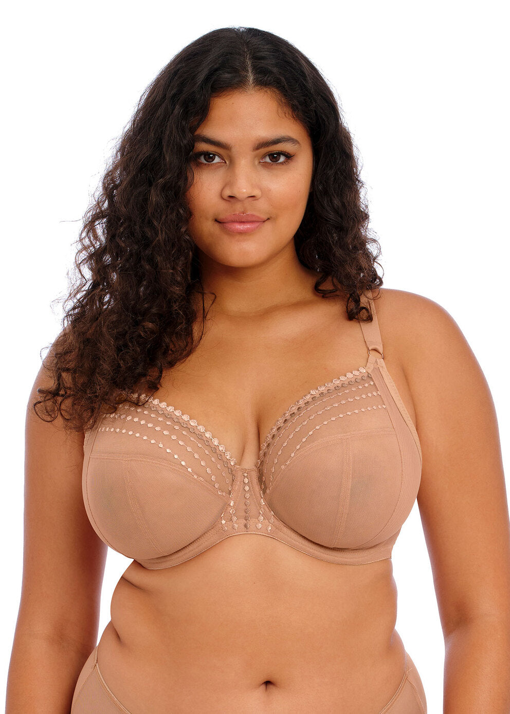 Woman wearing a beige bra on a white background