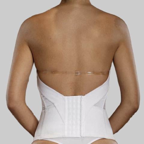 Person wearing a white back brace against a brown background