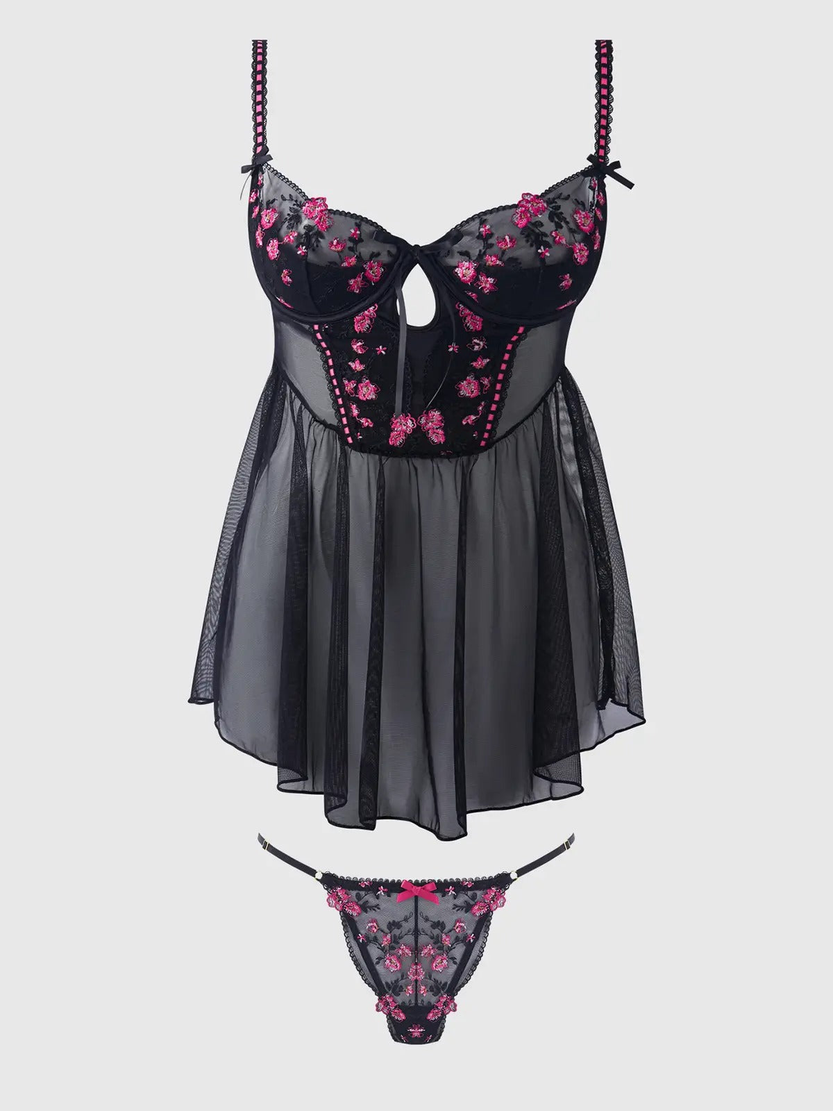 Black and pink floral lingerie set on a light gray background