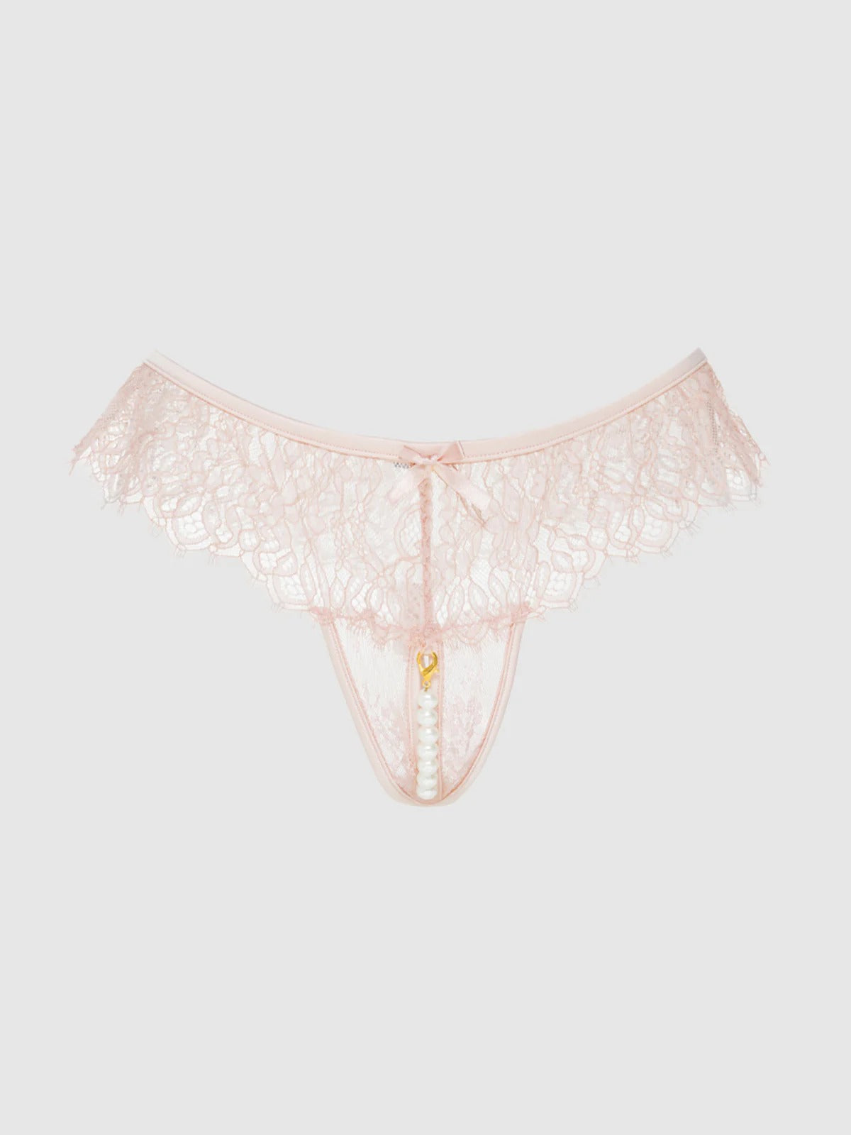 Pink lace thong on a light gray background