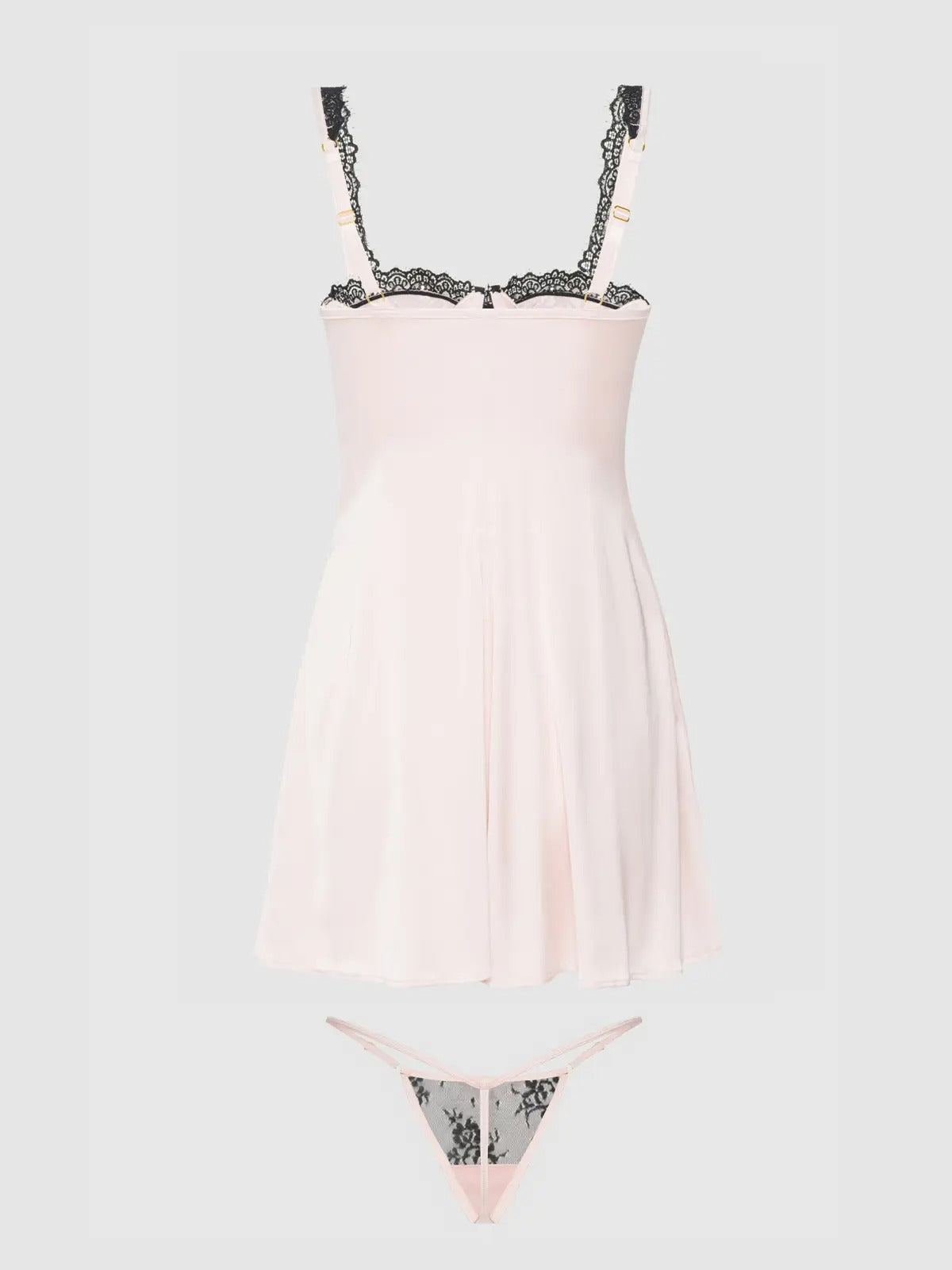 Light pink slip dress with lace details on a light gray background