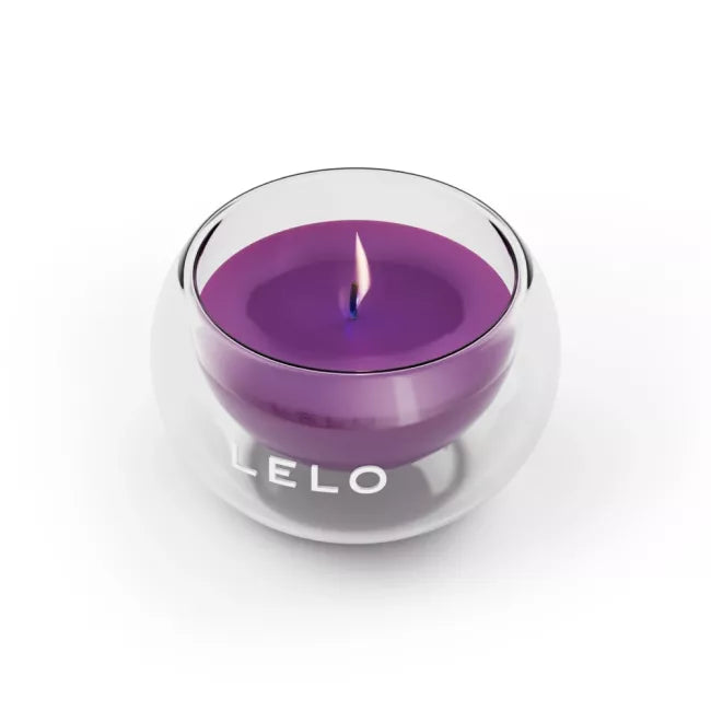 Purple candle in a glass holder with 'LELO' branding on a white background