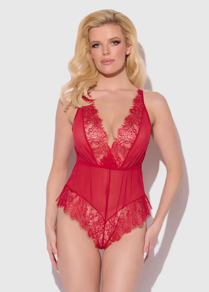 Woman wearing a red lace lingerie set on a white background