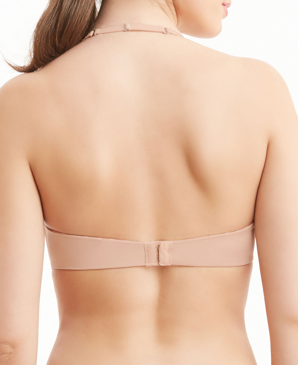 Beige bra worn by a model on a white background
