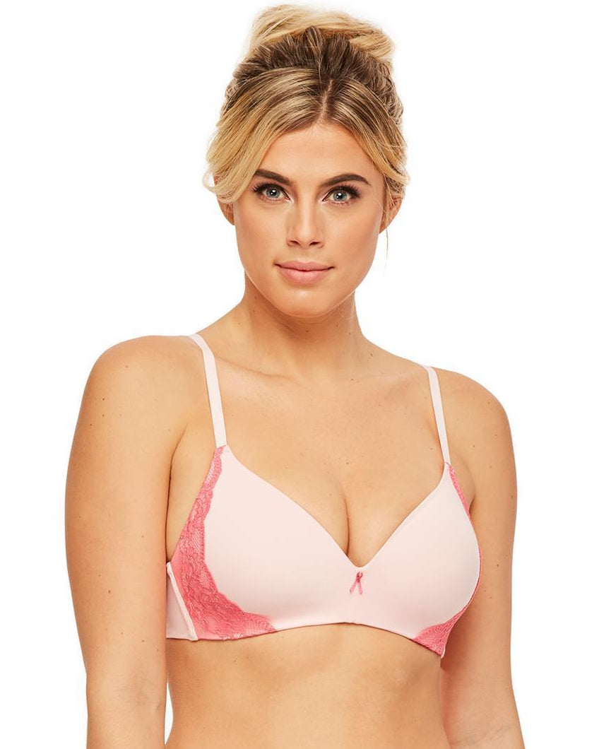 Woman wearing a pink bra and underwear set on a white background