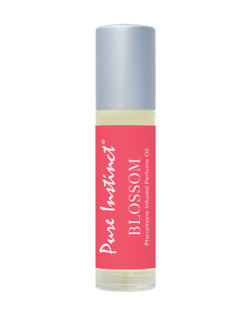 Perfume oil bottle with pink label and gray cap on a white background
