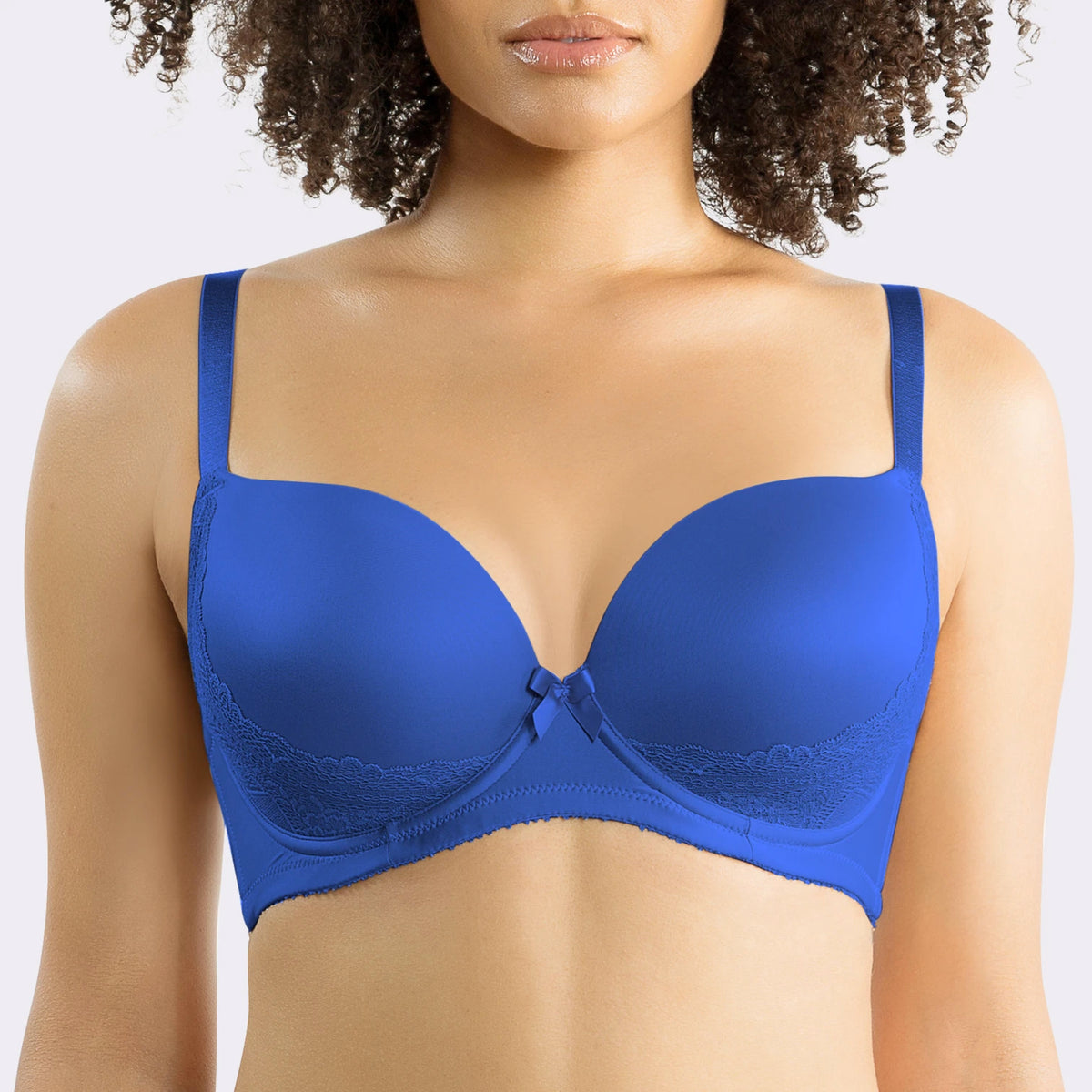 Blue bra worn by a model on a plain background