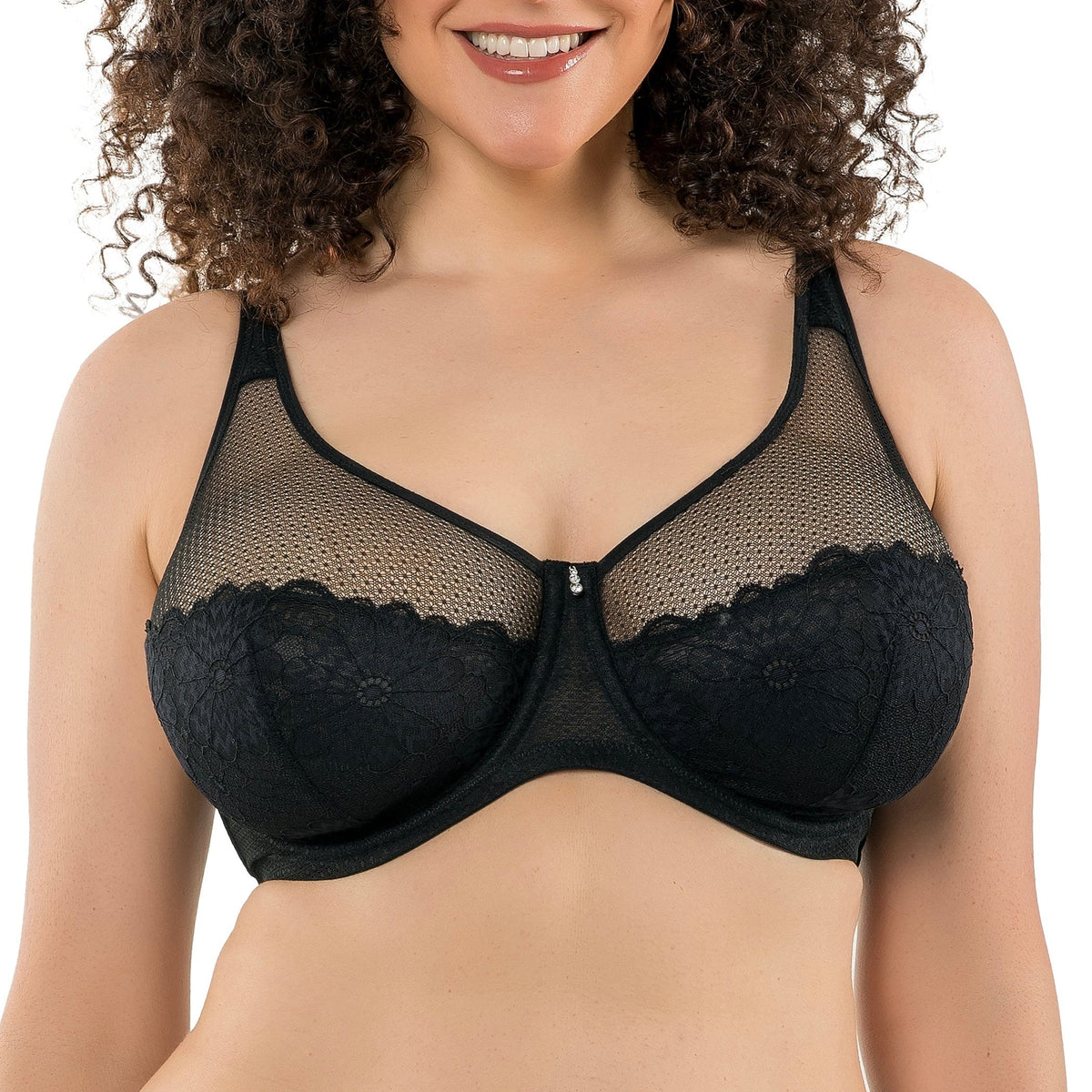 Woman wearing a black bra with mesh and lace details on a white background