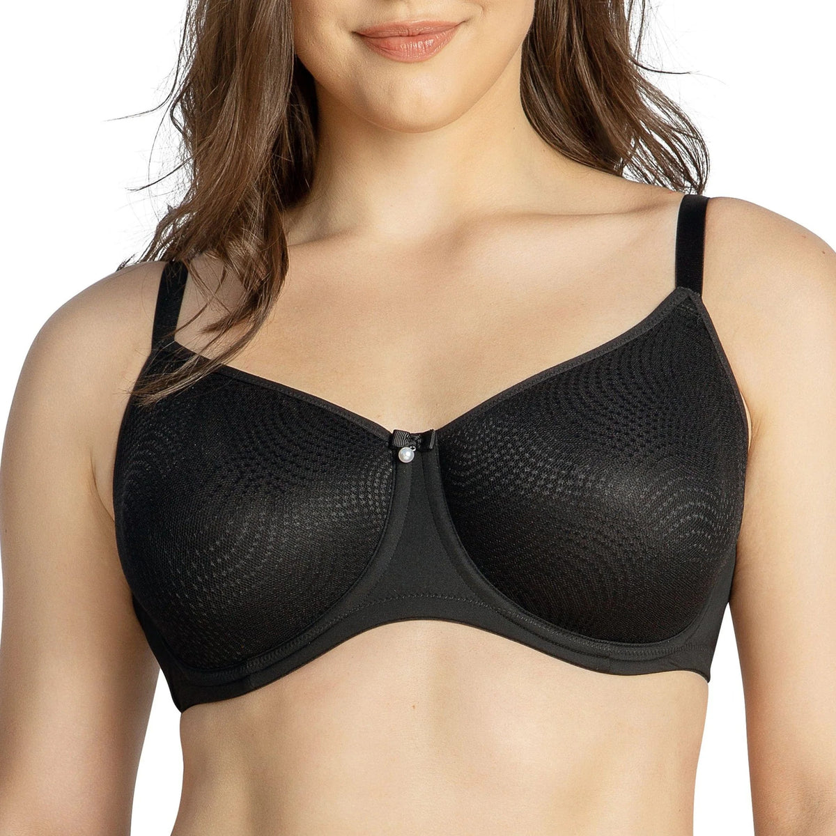 Woman wearing a black minimizer bra with smooth seamless cups and a balanced silhouette