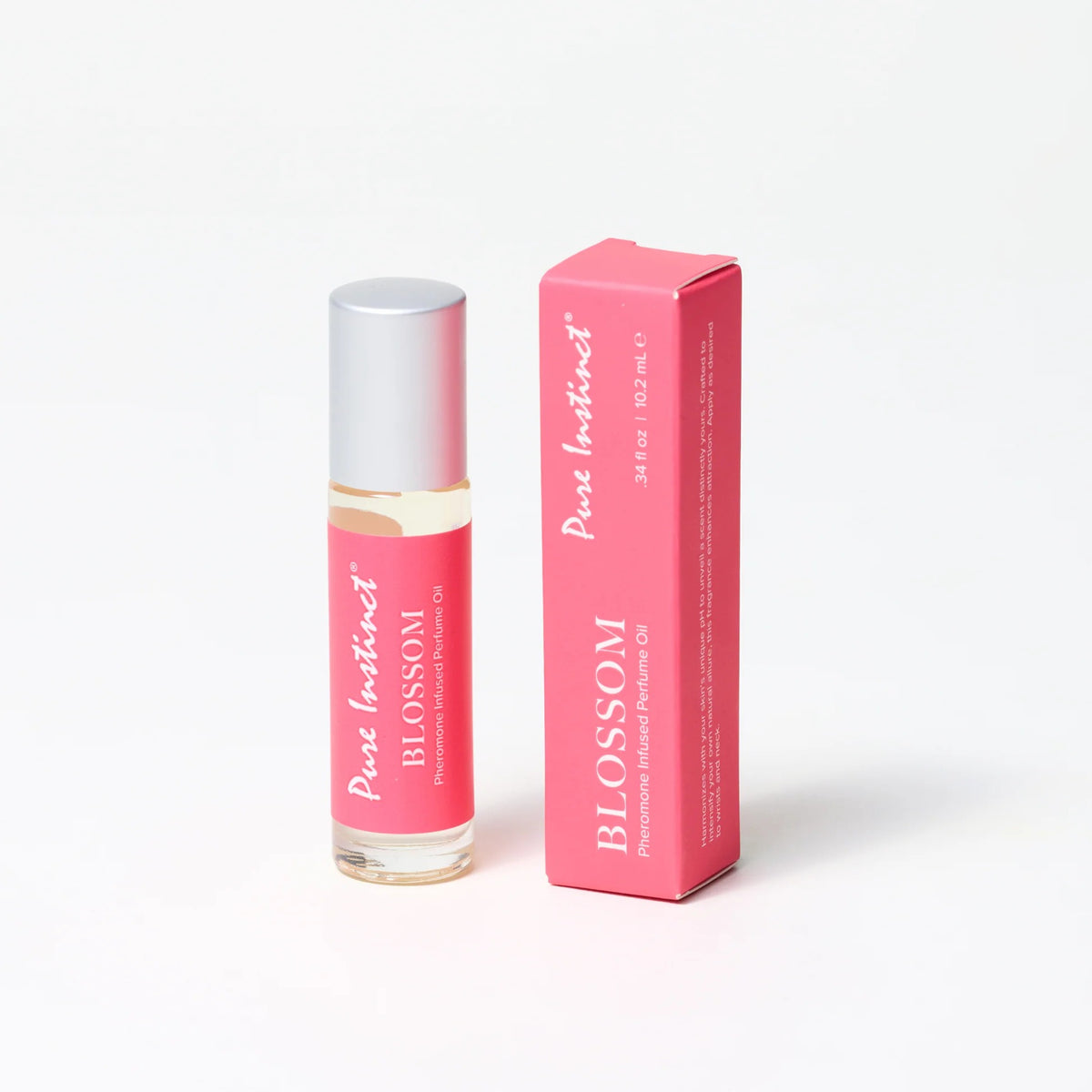 


Pink rollerball bottle and packaging of 'Pure Instinct Blossom' on a white background
