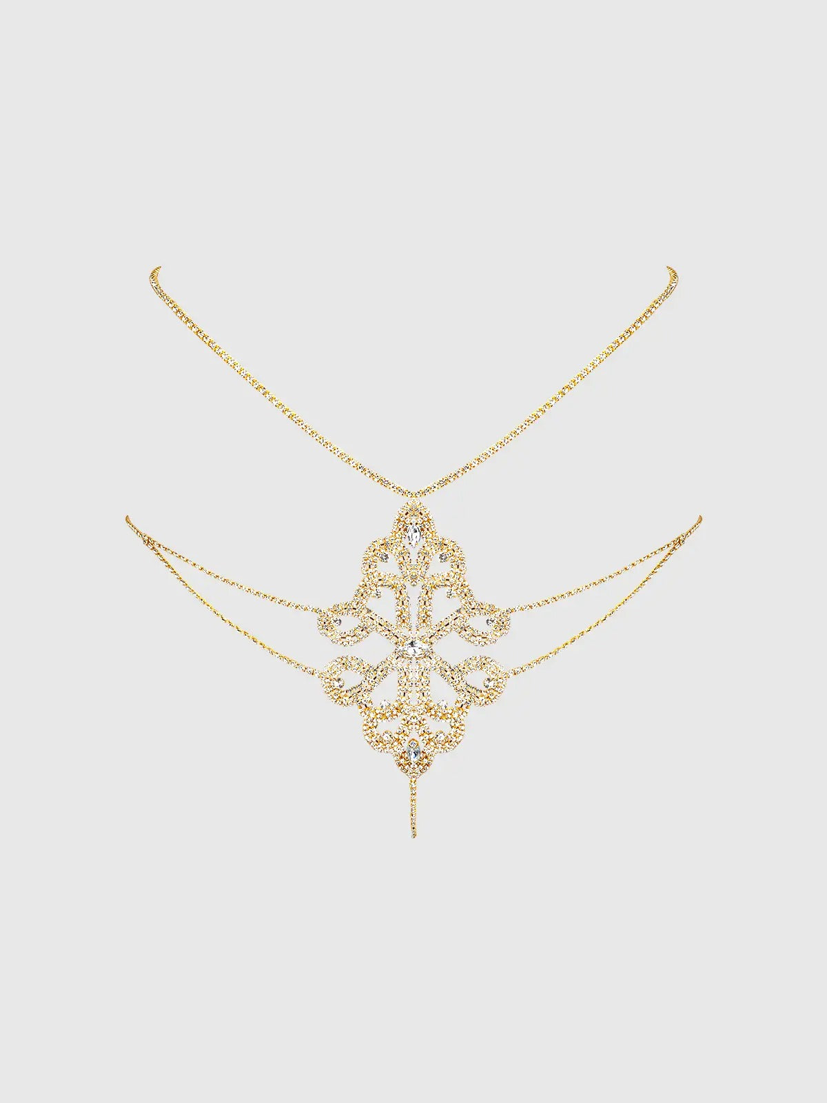 Gold rhinestone panty with intricate design on a light gray background