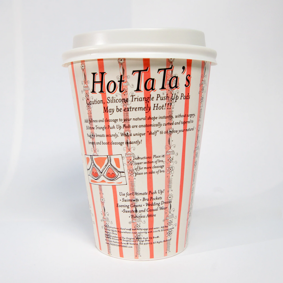 A white plastic travel cup with a lid, featuring red and white vertical stripes and black text that reads 'Hot TaTa's' and 'Quilton, Silicone Triangle Push Up Pads May be extremely Hot!!' on a white background.