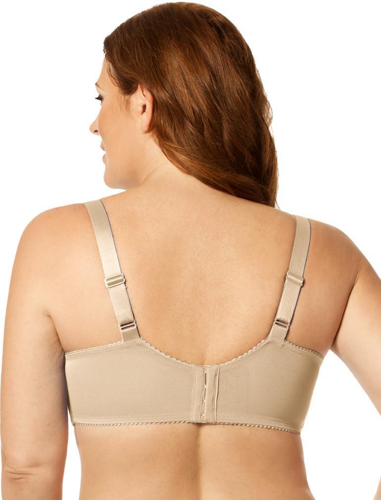 Woman wearing a beige bra on a white background