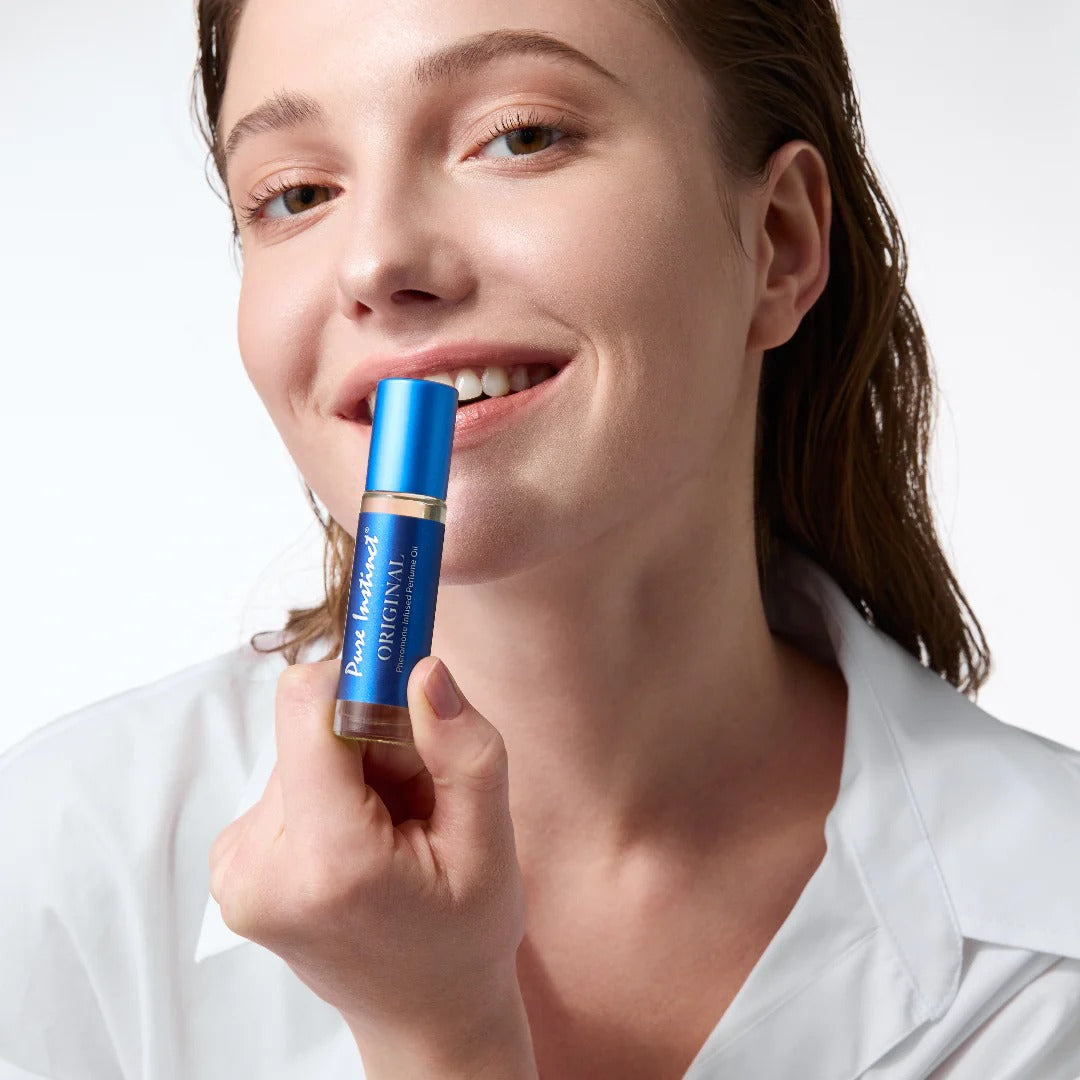 Woman holding a blue lip balm with a white background