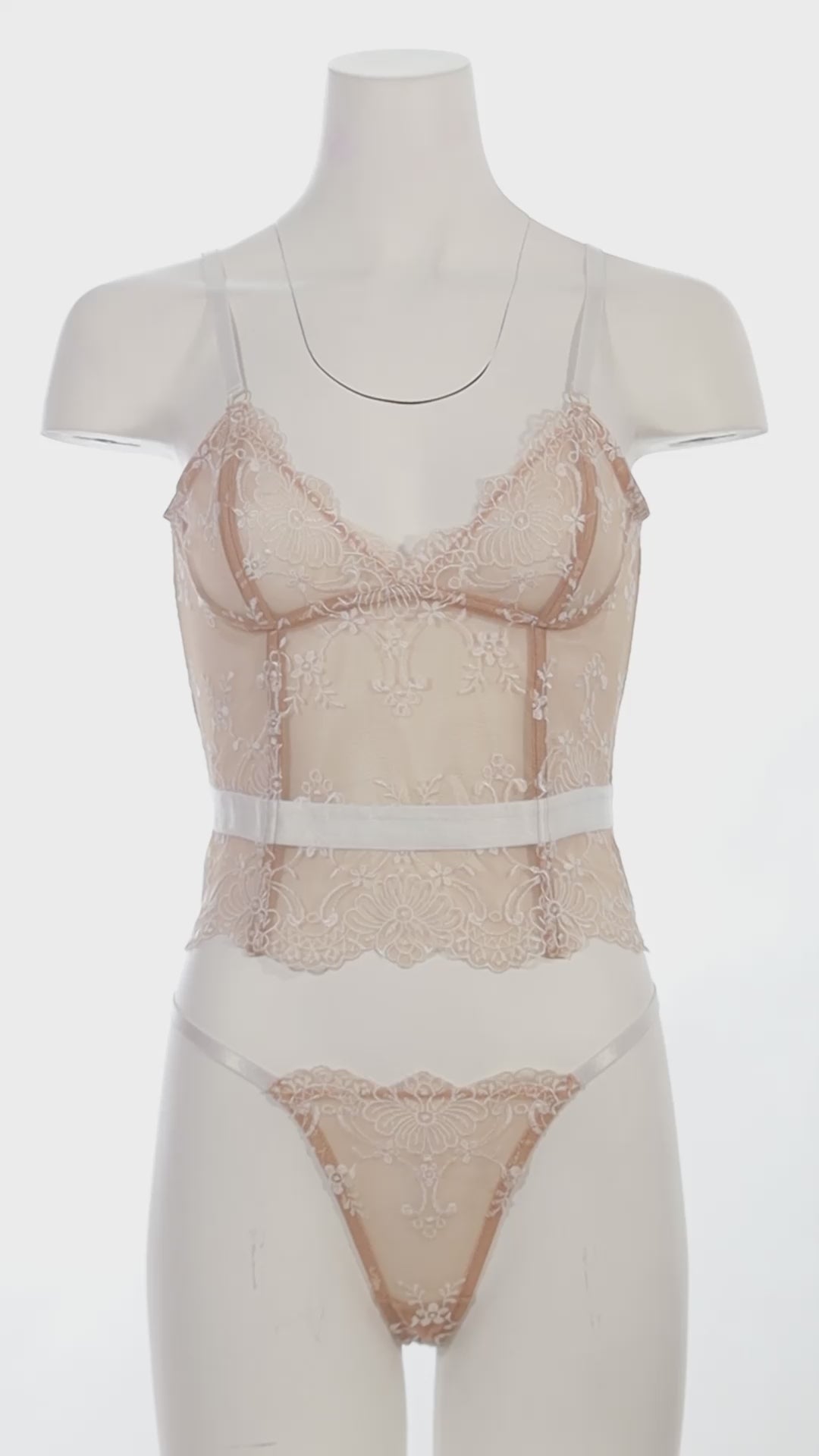 Mannequin wearing a Bridal Marielli bustier bra set with lace-up back and embroidered lace G-string