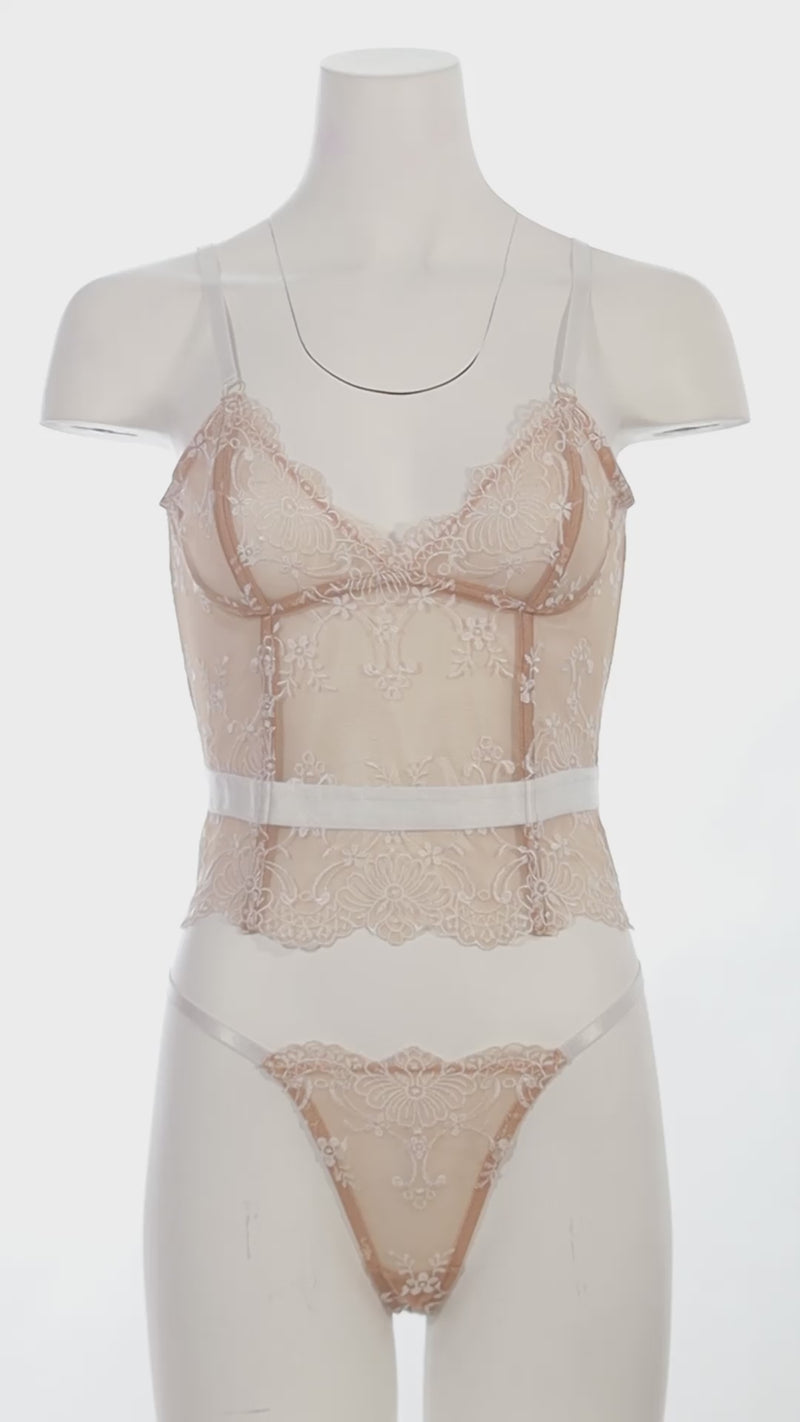 Mannequin wearing a Bridal Marielli bustier bra set with lace-up back and embroidered lace G-string