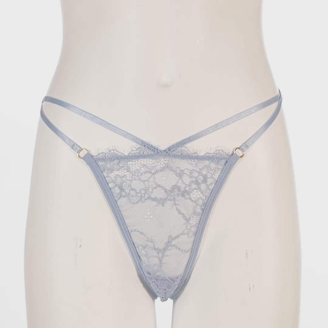 Light blue lace thong worn by a mannequin on a white background