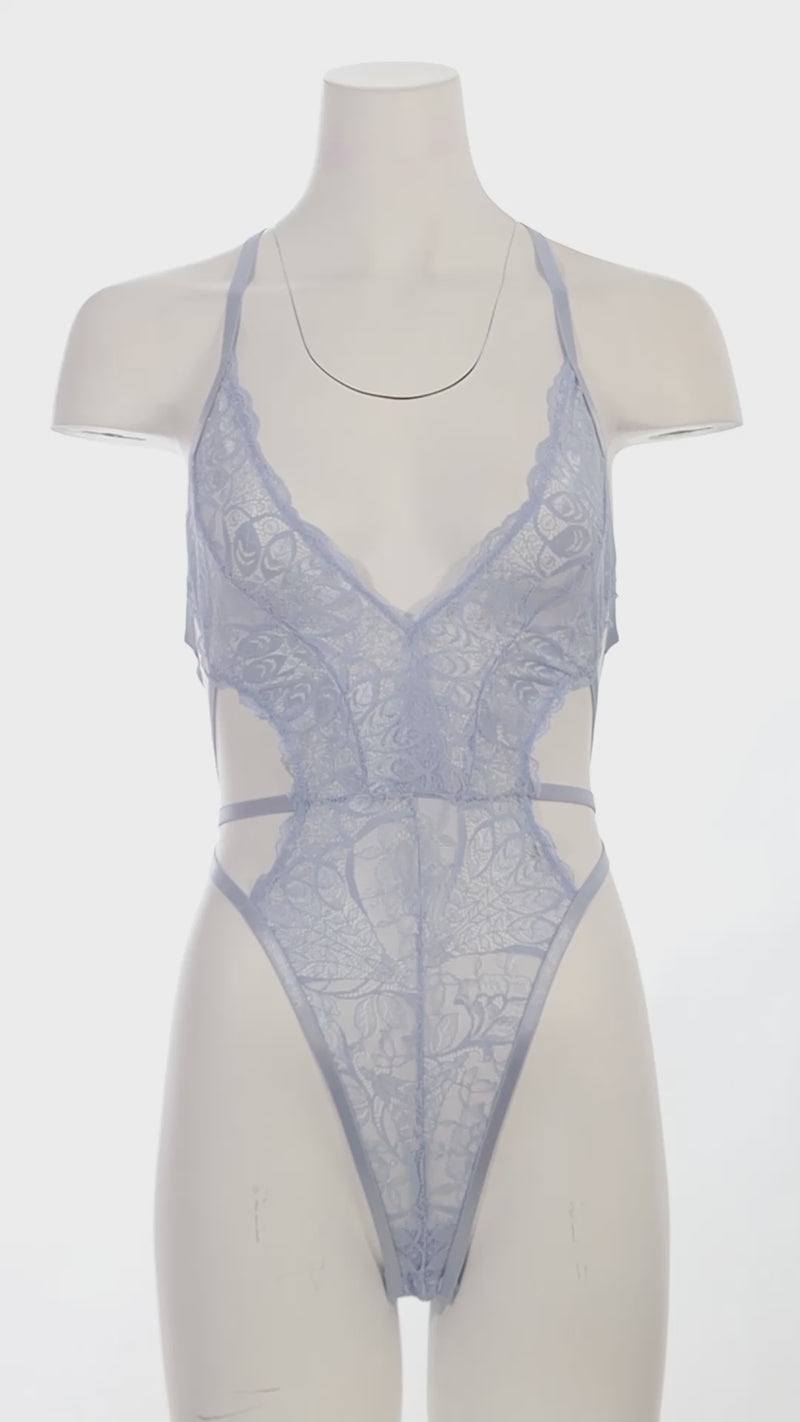 Mannequin wearing a lace lingerie set on a white background