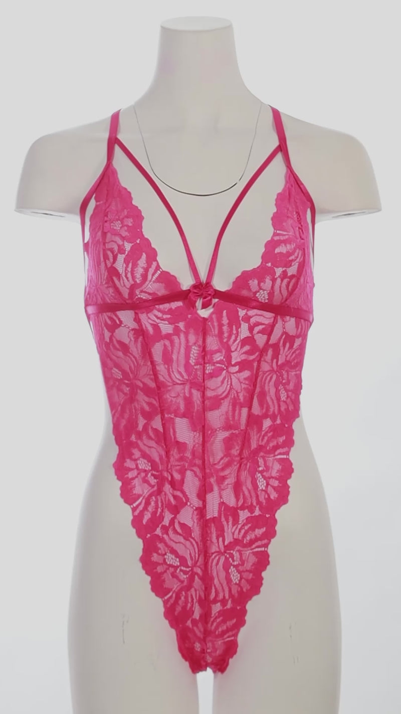 mannequin wearing a pink strappy bodysuit on a white background