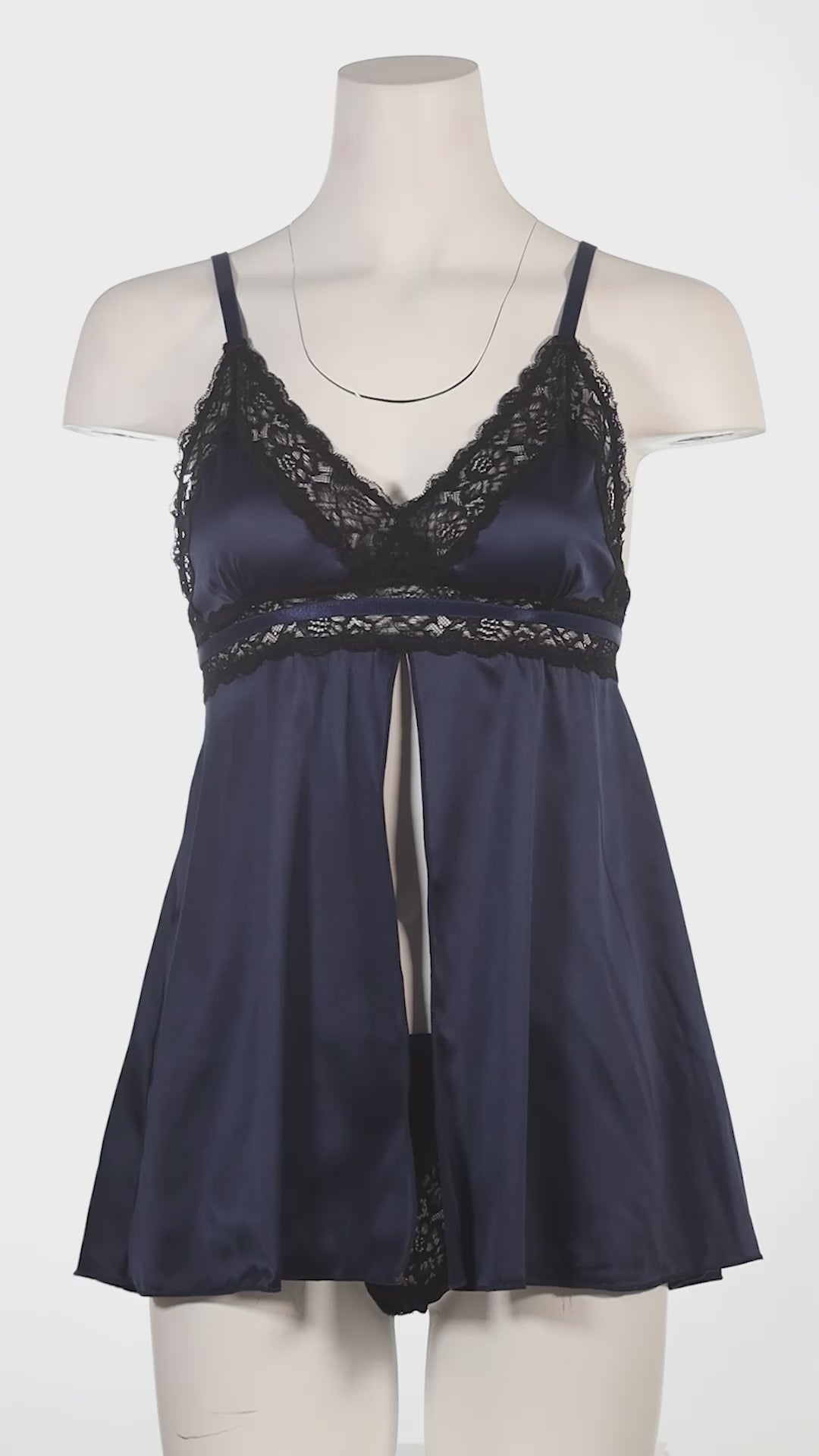 Navy blue nightgown with lace details on a white background