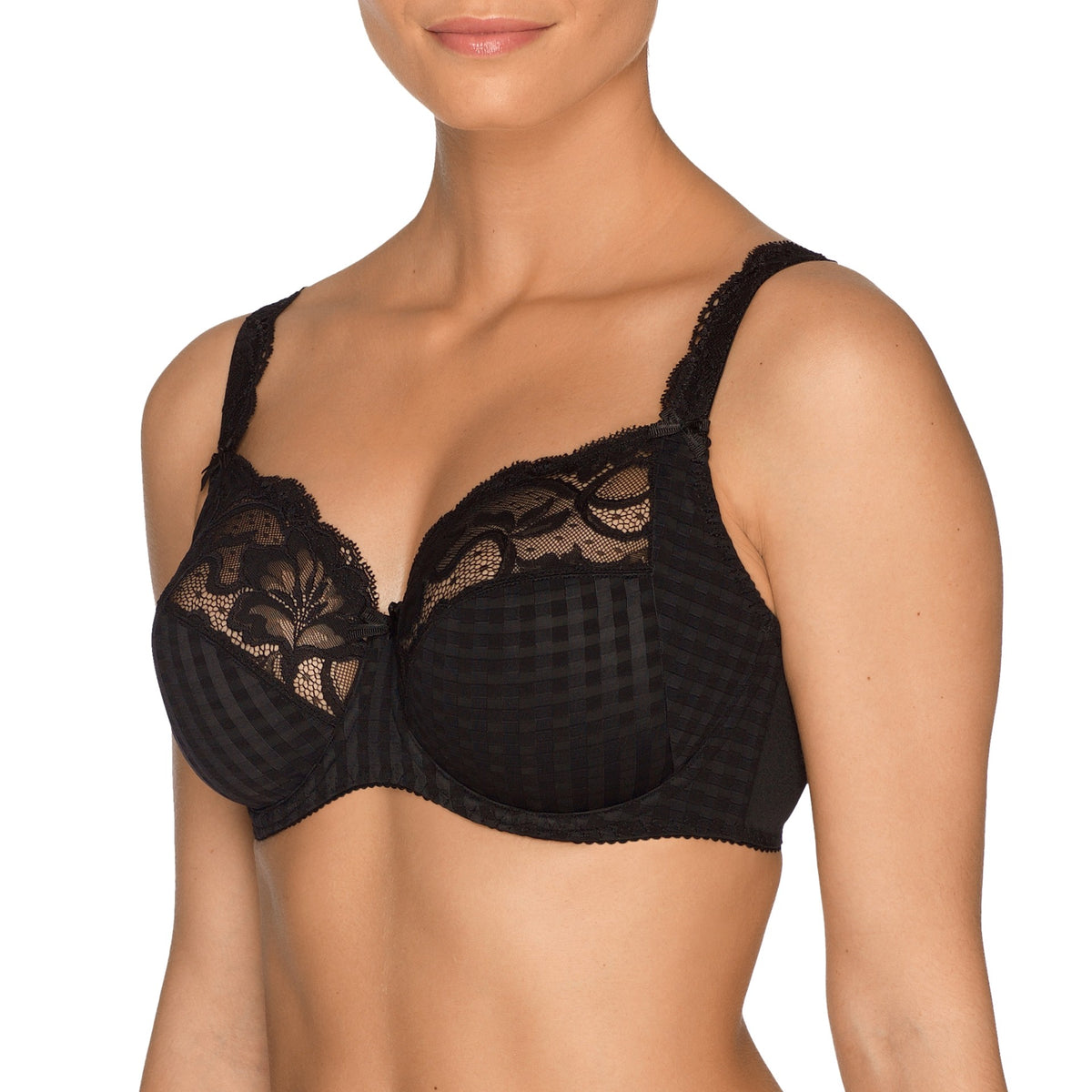 Black lace bra on a model against a white background